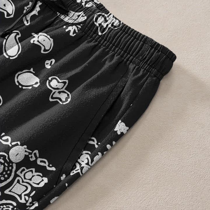 Buddha Stones Pantaloni da uomo affusolati in cotone con motivo patchwork paisley bianco e nero e tasche. - image 2