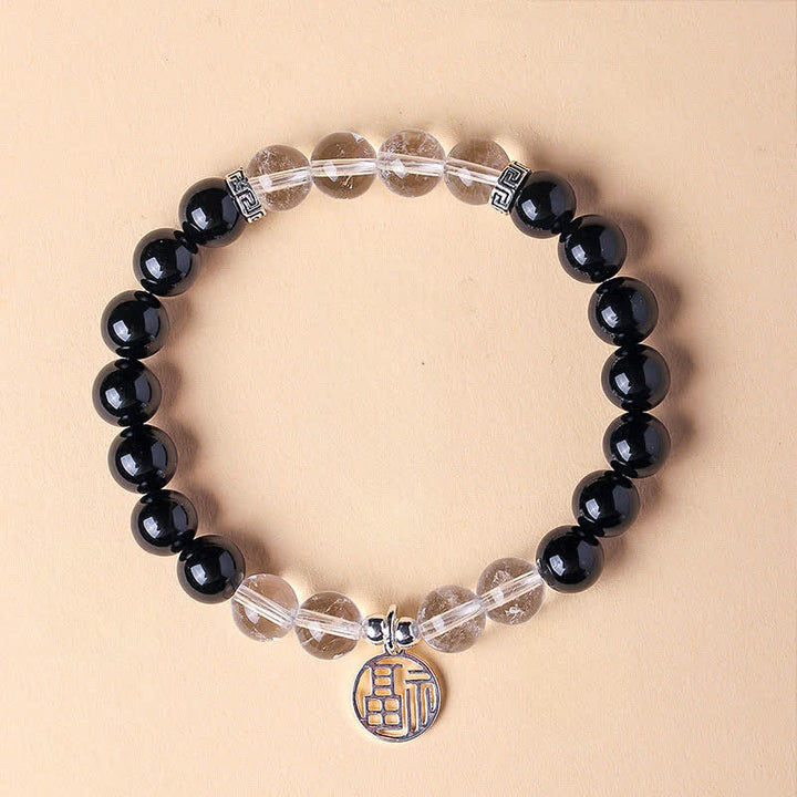 Buddha Stones Braccialetto portafortuna con perline e personaggio Fu in onice nera - Onice nero e quarzo trasparente (circonferenza del polso: 15-16 cm) - image 0