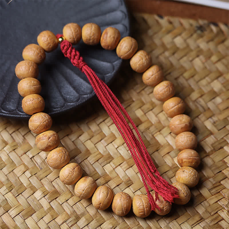 Buddha Stones Bracciale Mala con nappa incisa tibetana e occhio di fenice e Bodhi della saggezza. - image 1