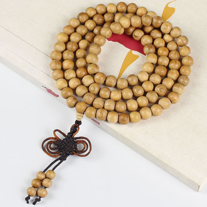 Buddha Stones Mala di 108 perle annodate e lucidate a mano in legno di pesco. - image 8