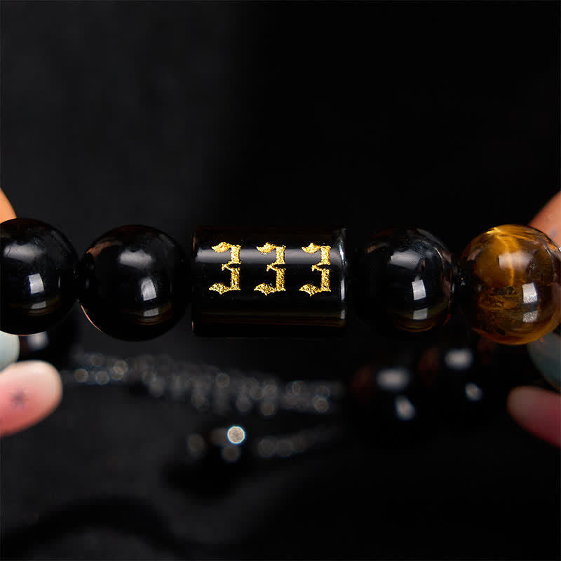 Buddha Stones Braccialetto con numero angelico, ossidiana nera naturale e occhio di tigre, simbolo di forza e realizzazione personale. - image 1