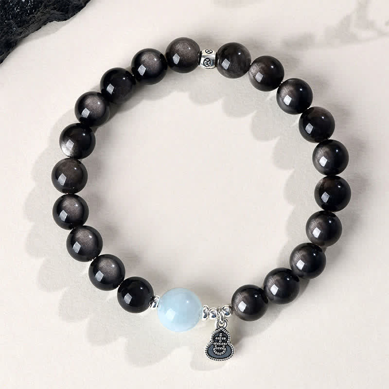 Buddha Stones Bracciale rotondo portafortuna a forma di zucca con ossidiana e acquamarina con riflessi argentati. - image 1