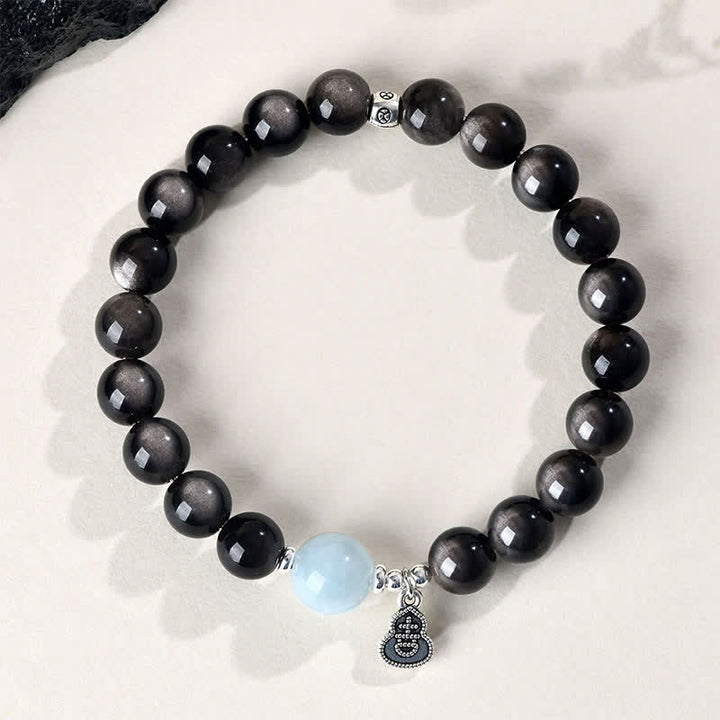 Buddha Stones Bracciale rotondo portafortuna a forma di zucca con ossidiana e acquamarina con riflessi argentati. - image 1