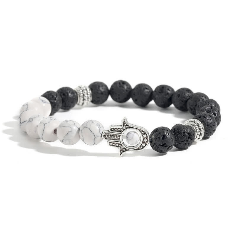 Buddha Stones Bracciale rotondo artigianale in pietra lavica con Hamsa per la protezione del palmo della mano (Hama). - Roccia turchese e lavica - image 1