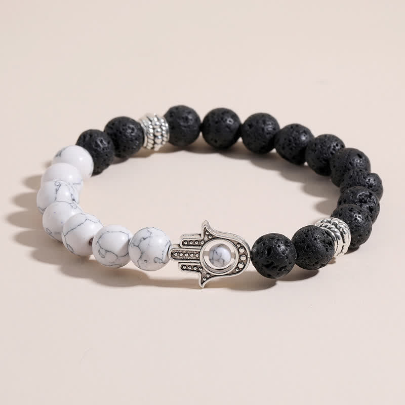 Buddha Stones Bracciale rotondo artigianale in pietra lavica con Hamsa per la protezione del palmo della mano (Hama). - image 0