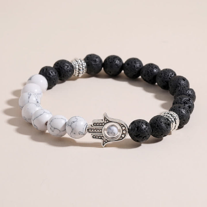 Buddha Stones Bracciale rotondo artigianale in pietra lavica con Hamsa per la protezione del palmo della mano (Hama). - image 0
