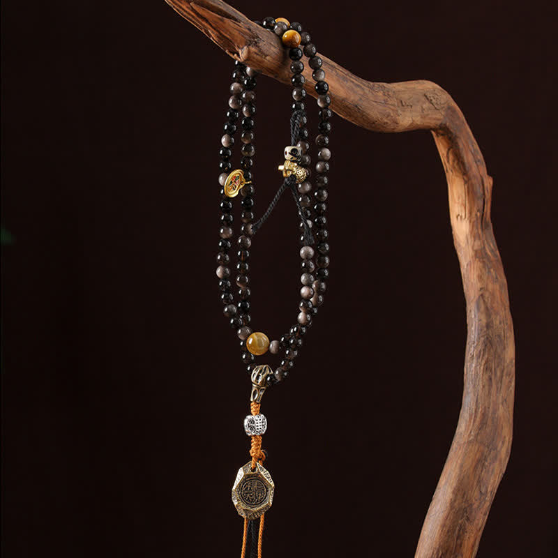 Buddha Stones Collana di perle intrecciate a mano con ciondolo a forma di Garuda in ossidiana con riflessi argentati, simbolo di protezione. - image 7