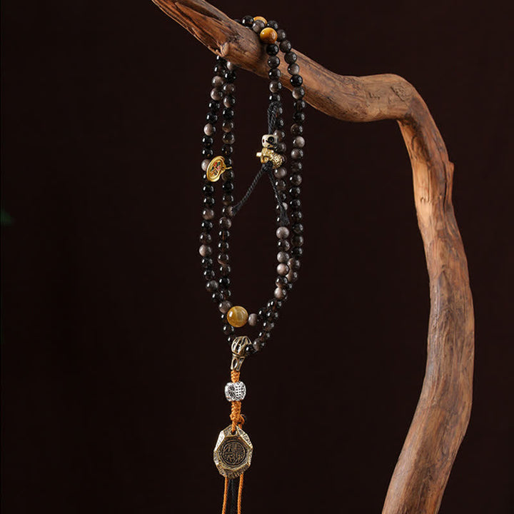 Buddha Stones Collana di perle intrecciate a mano con ciondolo a forma di Garuda in ossidiana con riflessi argentati, simbolo di protezione. - image 7