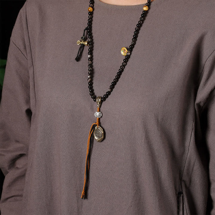 Buddha Stones Collana di perle intrecciate a mano con ciondolo a forma di Garuda in ossidiana con riflessi argentati, simbolo di protezione. - image 11