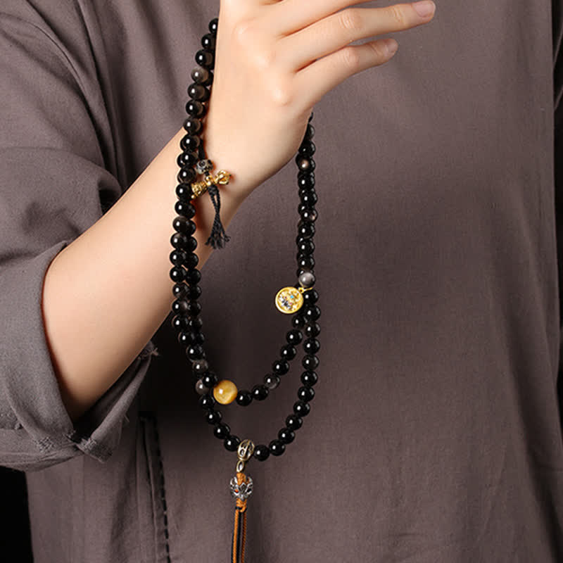 Buddha Stones Collana di perle intrecciate a mano con ciondolo a forma di Garuda in ossidiana con riflessi argentati, simbolo di protezione. - image 9