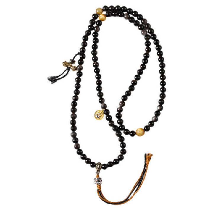 Buddha Stones Collana di perle intrecciate a mano con ciondolo a forma di Garuda in ossidiana con riflessi argentati, simbolo di protezione. - image 15