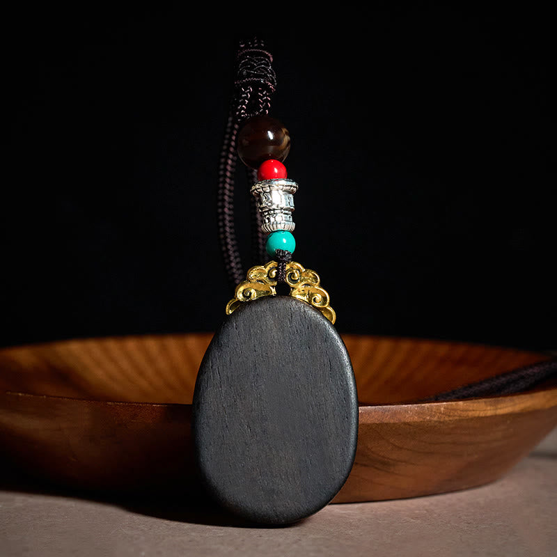 Buddha Stones Collana ovale tribale fatta a mano in legno di ebano con scritta "Saggezza" - image 2