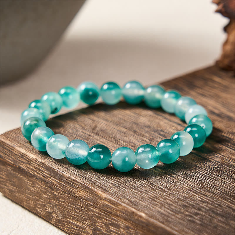 Buddha Stones Bracciale rotondo con perline blu e motivo floreale in calcedonio bianco e scritta "Equilibrio Emozionale" - 8 mm - Calcedonio bianco (Armonia♥Positivo) - image 0