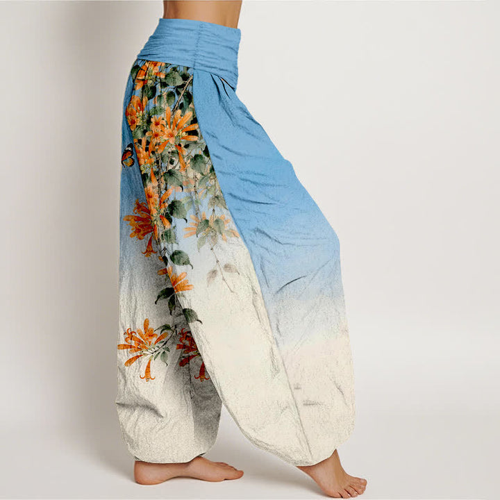 Buddha Stones Pantaloni harem da donna in cotone arancione con fantasia floreale e farfalle, vita elasticizzata. - image 1
