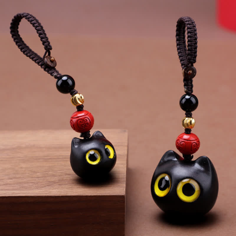 Buddha Stones Portachiavi in ​​legno d'ebano con simpatico gatto, intagliati a mano, simbolo di pace e radicamento. - image 0