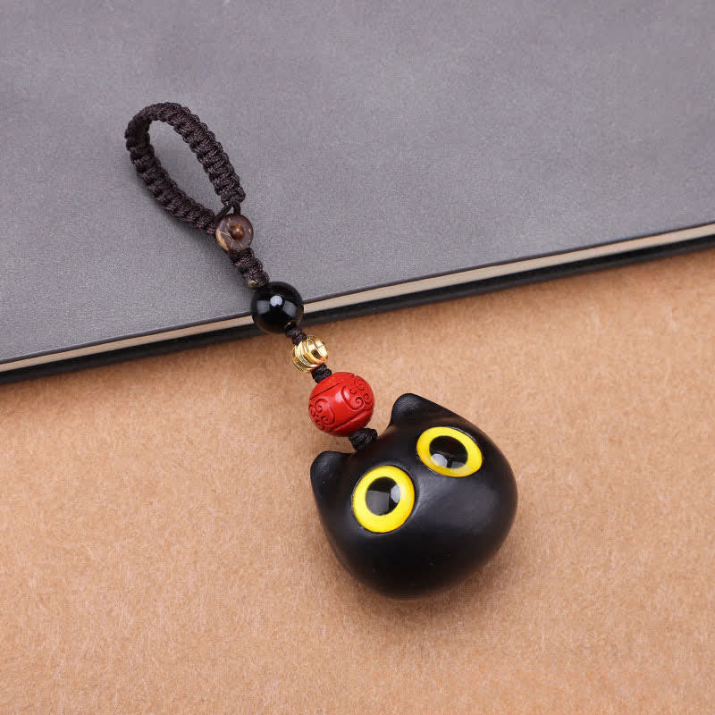 Buddha Stones Portachiavi in ​​legno d'ebano con simpatico gatto, intagliati a mano, simbolo di pace e radicamento. - Corda intrecciata per gatti di grandi dimensioni - image 1