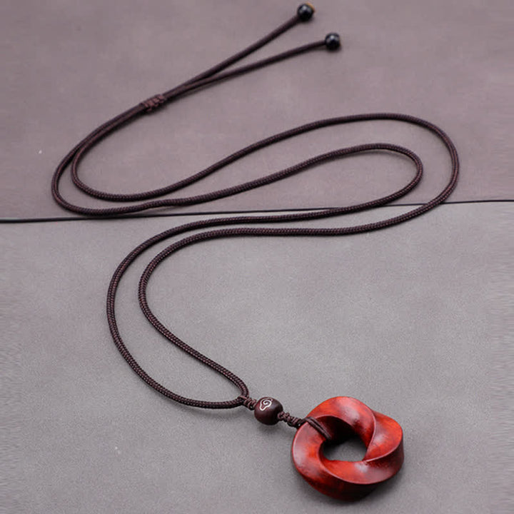 Buddha Stones Collana con ciondolo a forma di nodo infinito e corda dell'eternità in legno di sandalo rosso - image 7