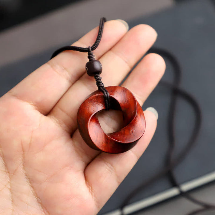 Buddha Stones Collana con ciondolo a forma di nodo infinito e corda dell'eternità in legno di sandalo rosso - image 10