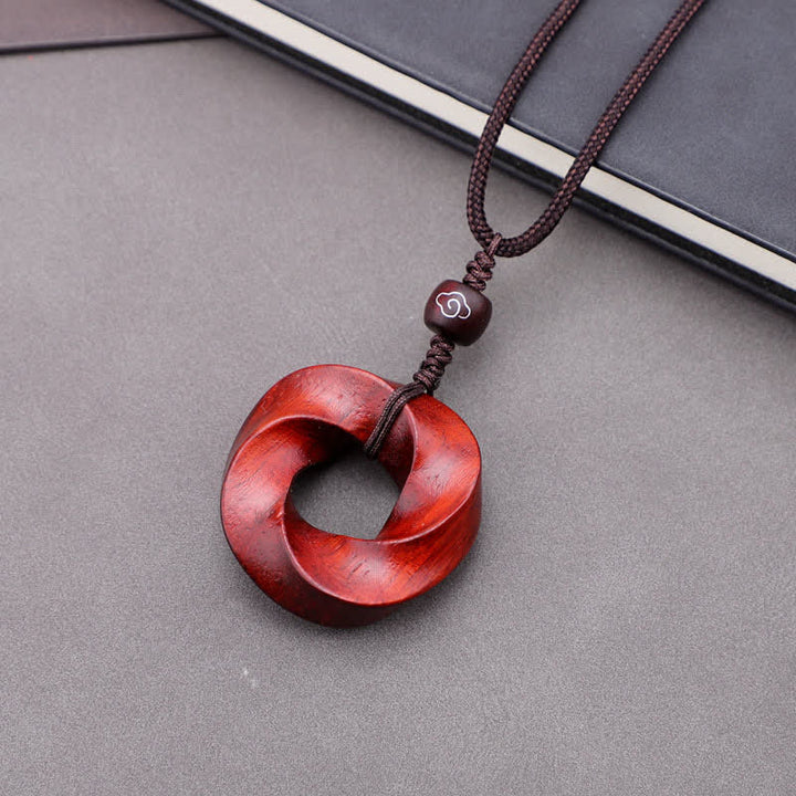 Buddha Stones Collana con ciondolo a forma di nodo infinito e corda dell'eternità in legno di sandalo rosso - Sandalo rosso (Benedizione ♥ Ricchezza) - image 0