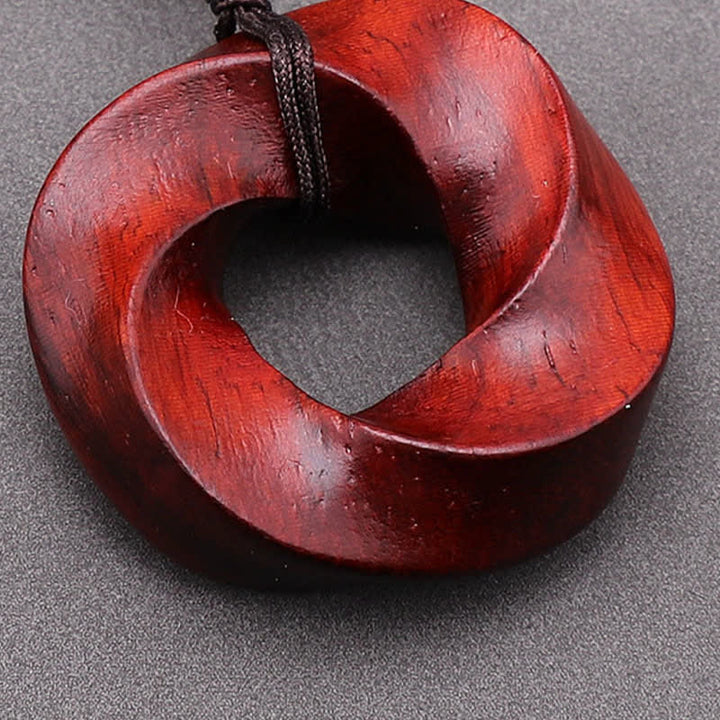 Buddha Stones Collana con ciondolo a forma di nodo infinito e corda dell'eternità in legno di sandalo rosso - image 11