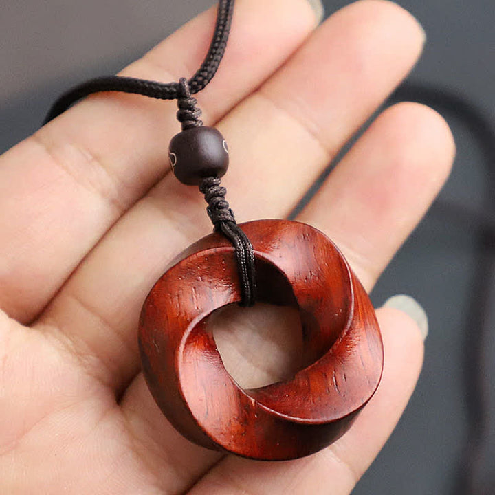 Buddha Stones Collana con ciondolo a forma di nodo infinito e corda dell'eternità in legno di sandalo rosso - image 9