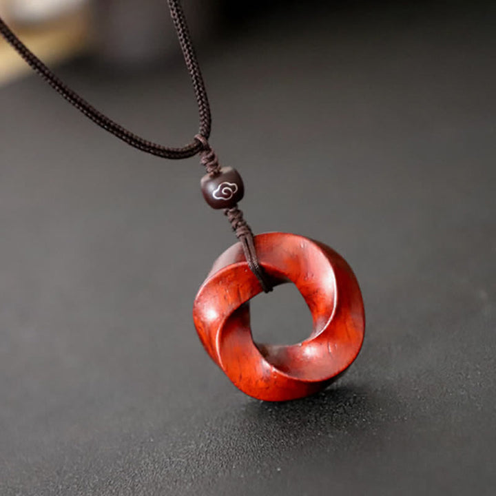 Buddha Stones Collana con ciondolo a forma di nodo infinito e corda dell'eternità in legno di sandalo rosso - image 2