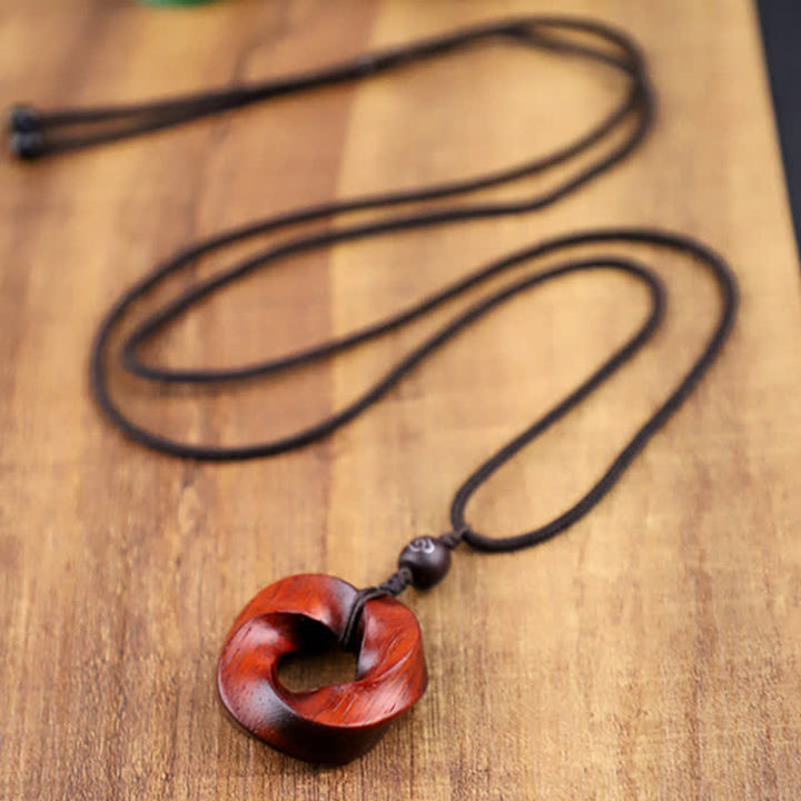 Buddha Stones Collana con ciondolo a forma di nodo infinito e corda dell'eternità in legno di sandalo rosso - image 8