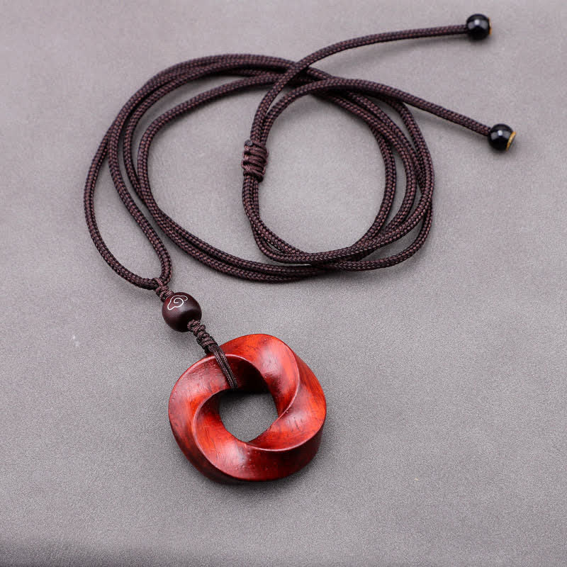 Buddha Stones Collana con ciondolo a forma di nodo infinito e corda dell'eternità in legno di sandalo rosso - image 6