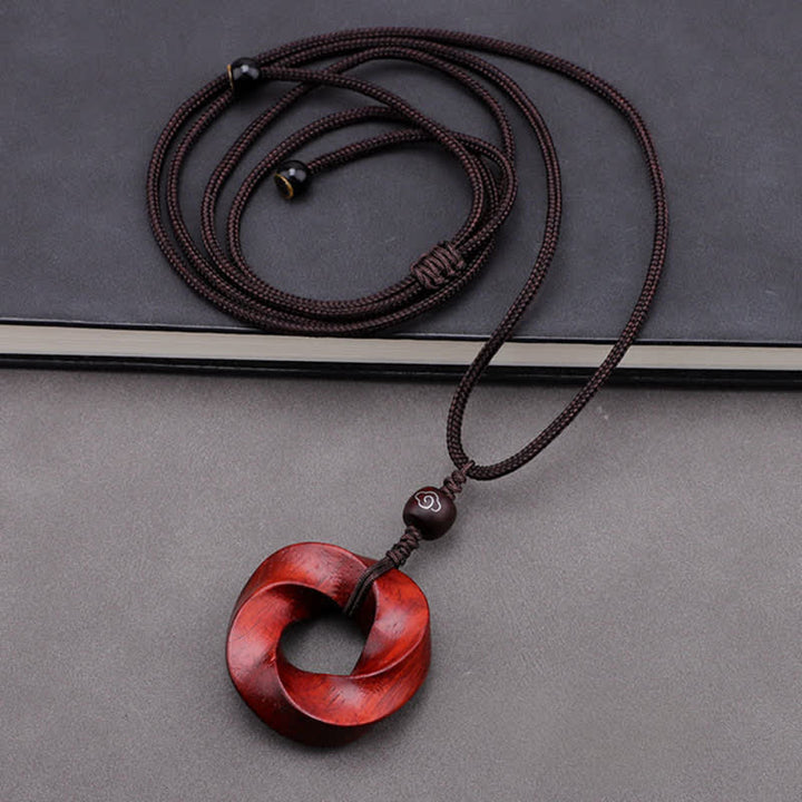 Buddha Stones Collana con ciondolo a forma di nodo infinito e corda dell'eternità in legno di sandalo rosso - image 4