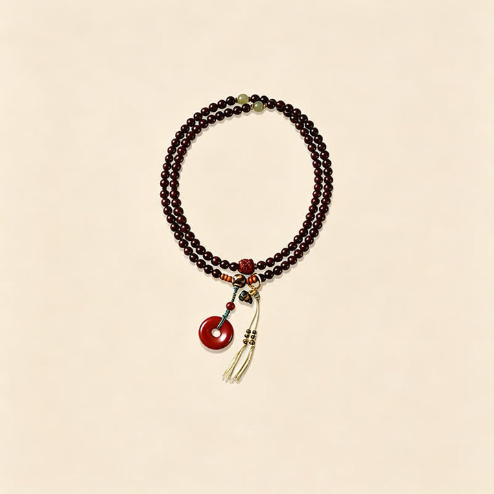 Buddha Stones Mala di protezione con fibbia della pace in legno di sandalo rosso, intrecciata a mano con 108 perline. - image 6