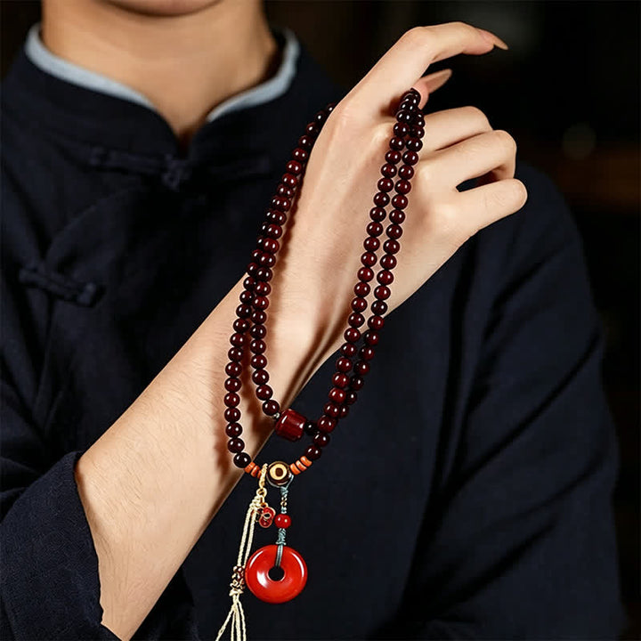 Buddha Stones Mala di protezione con fibbia della pace in legno di sandalo rosso, intrecciata a mano con 108 perline. - image 9