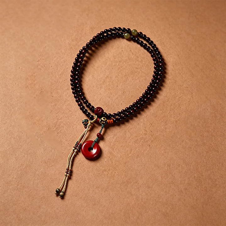 Buddha Stones Mala di protezione con fibbia della pace in legno di sandalo rosso, intrecciata a mano con 108 perline. - image 2