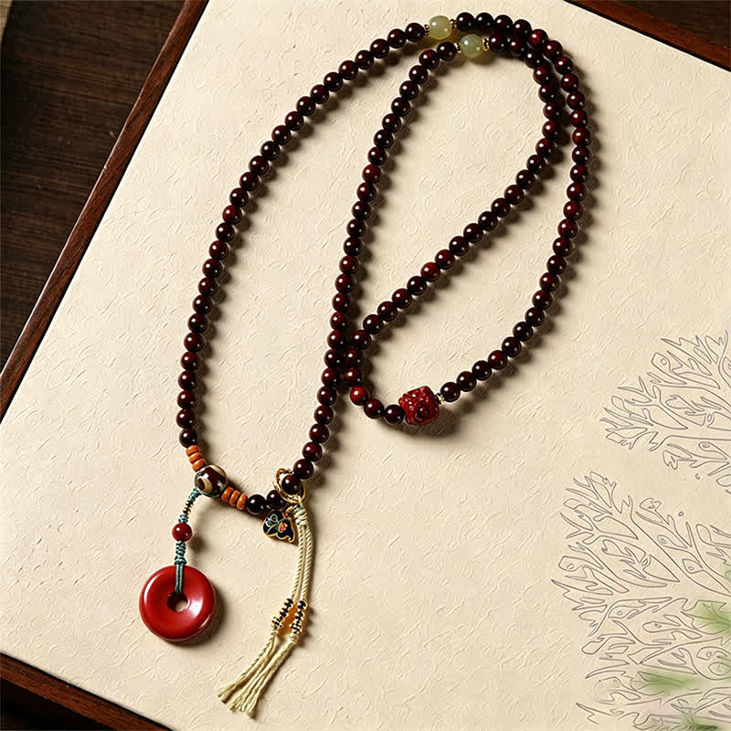 Buddha Stones Mala di protezione con fibbia della pace in legno di sandalo rosso, intrecciata a mano con 108 perline. - image 3