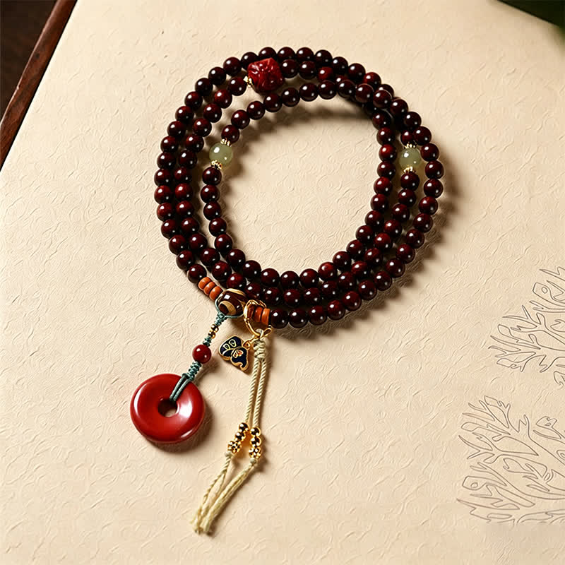 Buddha Stones Mala di protezione con fibbia della pace in legno di sandalo rosso, intrecciata a mano con 108 perline. - Palissandro rosso (Energia di radicamento ♥ Forza interiore) - image 0
