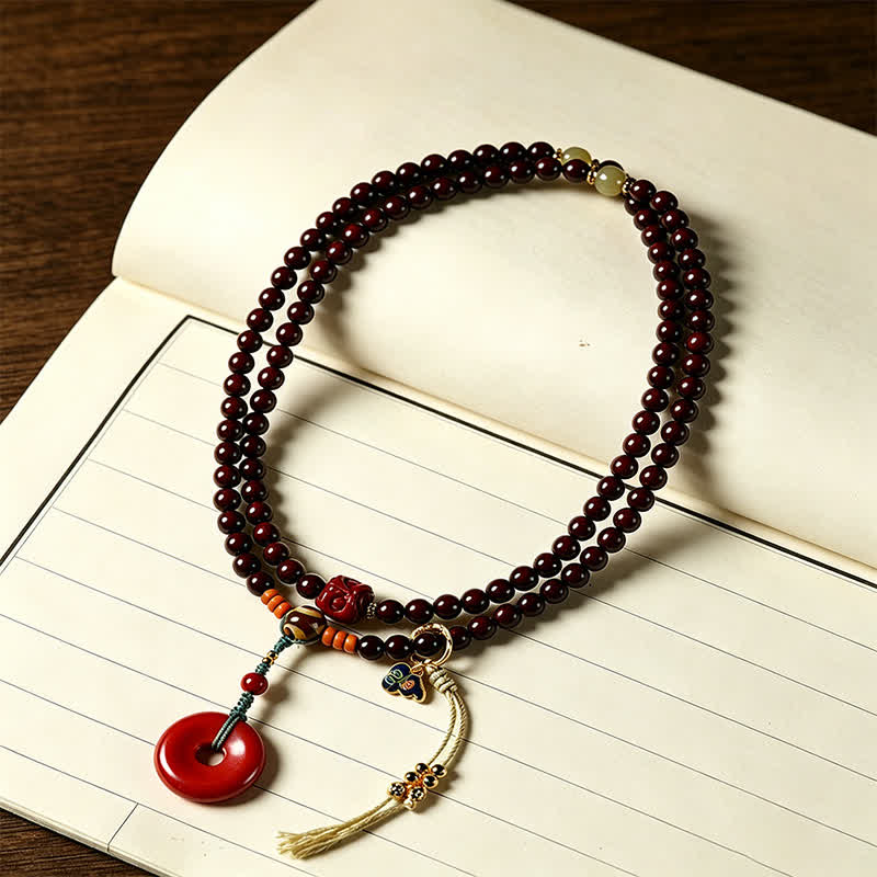 Buddha Stones Mala di protezione con fibbia della pace in legno di sandalo rosso, intrecciata a mano con 108 perline. - image 1