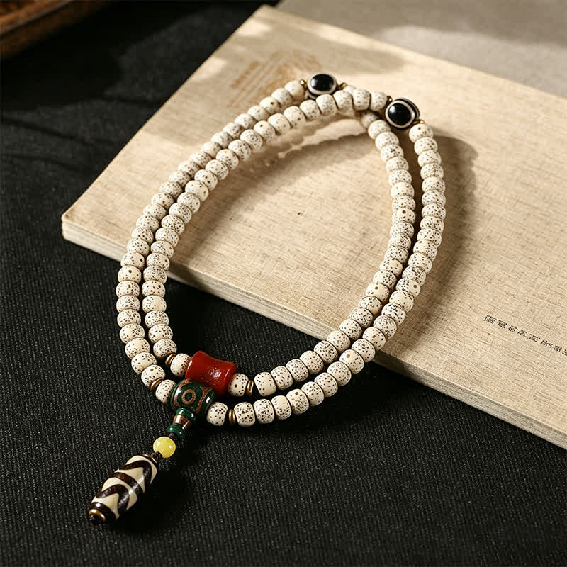 Buddha Stones Mala tibetano intrecciato a mano con 108 perle, composto da semi di Bodhi e stella, luna e pietra. - image 1
