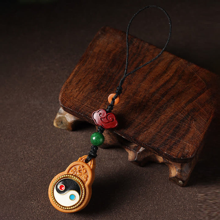 Buddha Stones Decorazione da appendere al telefono a forma di zucca con simbolo Yin Yang e legno di sandalo verde Bagua. - image 1