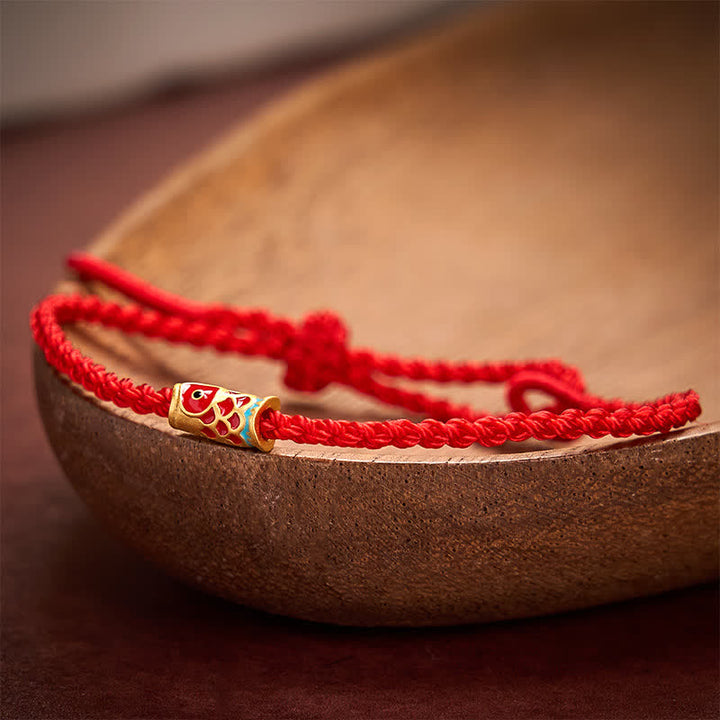 Buddha Stones Braccialetto portafortuna con cordino intrecciato a mano a forma di pesce koi rosso. - image 1