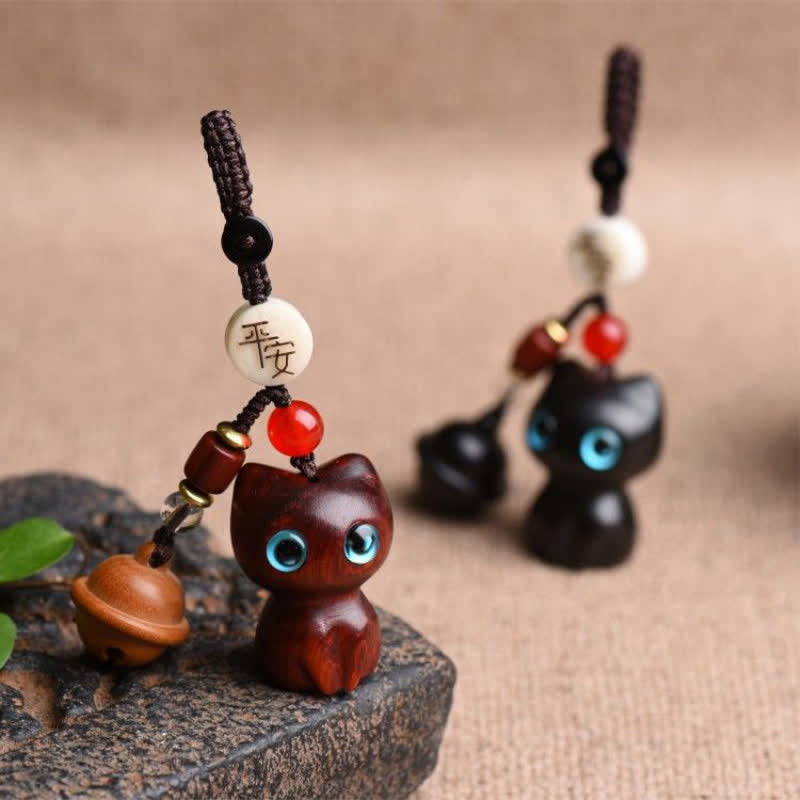Buddha Stones Portachiavi con campanellino di protezione per gatti, intagliati a mano in legno di ebano e sandalo rosso. - image 1