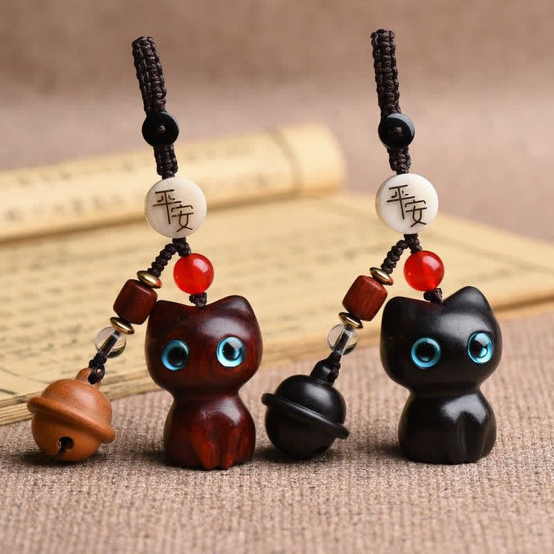 Buddha Stones Portachiavi con campanellino di protezione per gatti, intagliati a mano in legno di ebano e sandalo rosso. - image 0