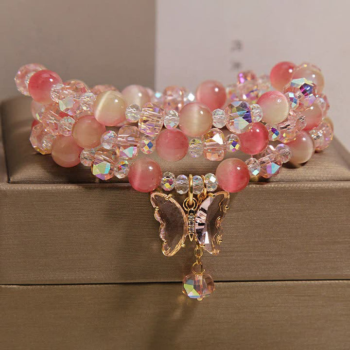 Buddha Stones Bracciale a triplo giro sfaccettato con farfalla occhio di gatto color pesca e motivo "Amore". - image 2