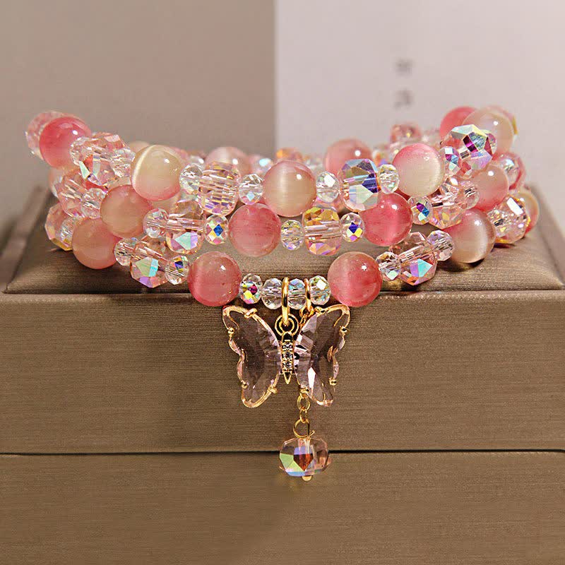 Buddha Stones Bracciale a triplo giro sfaccettato con farfalla occhio di gatto color pesca e motivo "Amore". - image 1