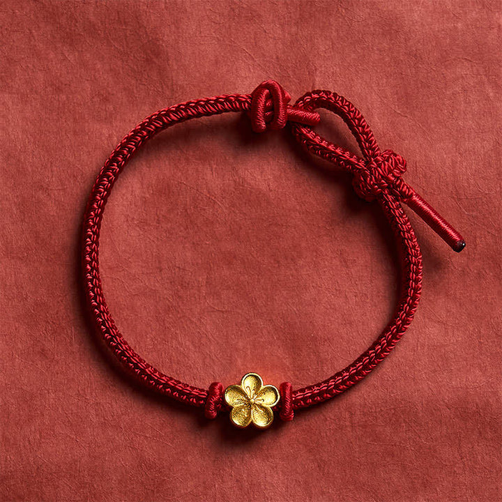 Buddha Stones Braccialetto portafortuna con cordino intrecciato a mano in filo rosso e fiore di pesco. - image 1