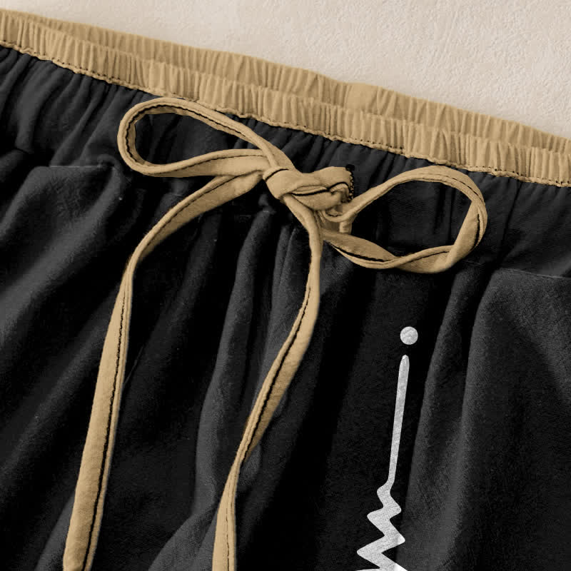 Buddha Stones Pantaloni da donna in puro cotone con elastico in vita e tasche, decorati con il simbolo Om. - image 1