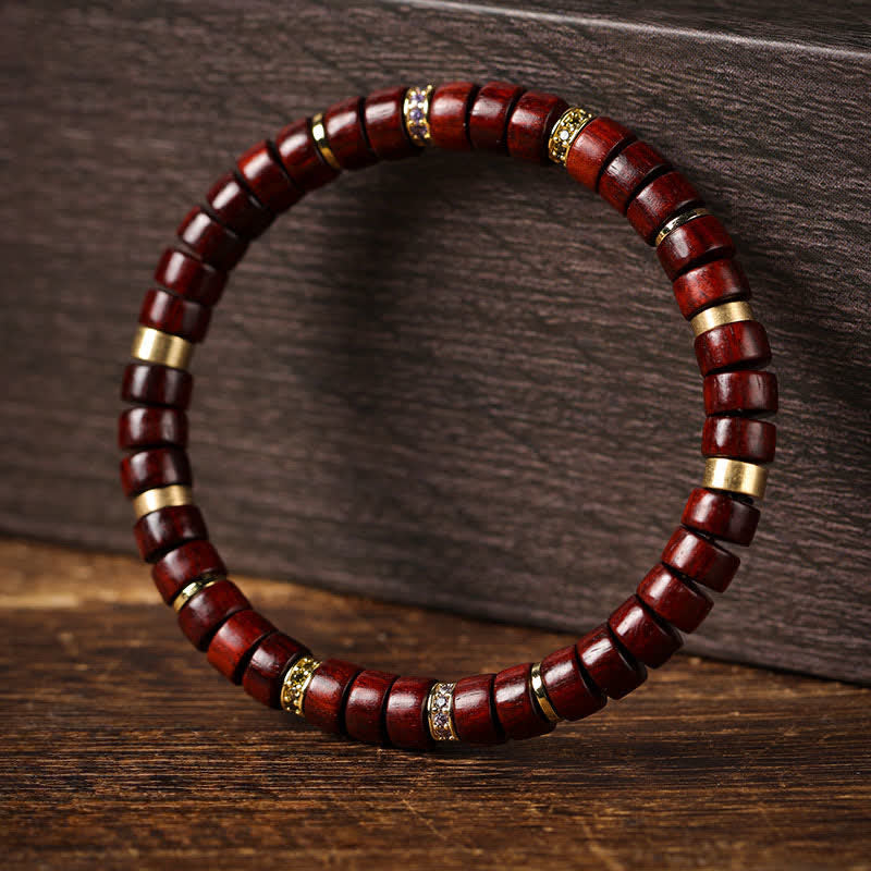 Buddha Stones Bracciale minimalista con perline a barilotto in legno di palissandro rosso e ebano. - image 1