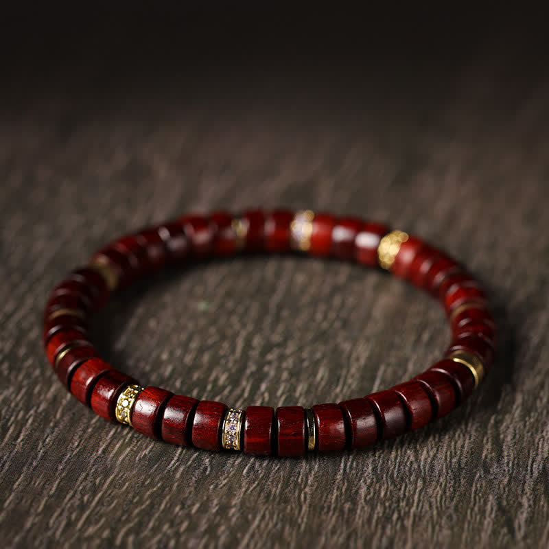 Buddha Stones Bracciale minimalista con perline a barilotto in legno di palissandro rosso e ebano. - image 1