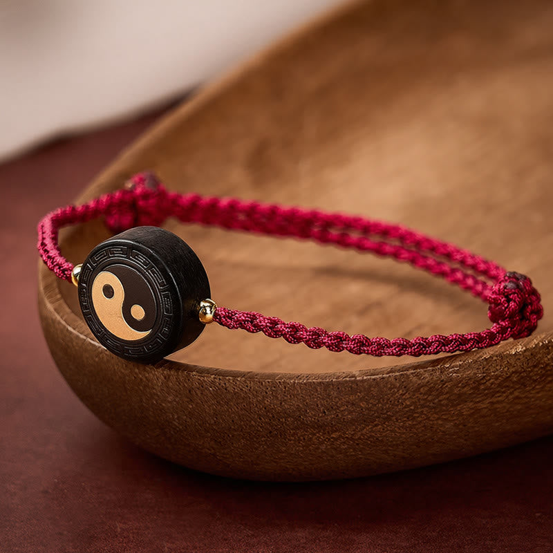 Buddha Stones Braccialetto Bagua in legno d'ebano con cordino rosso per radicamento. - image 0