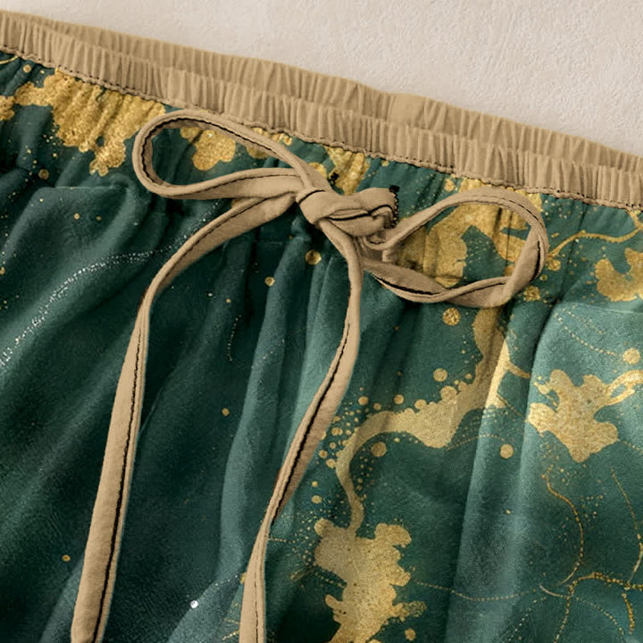 Buddha Stones Eleganti pantaloni da donna in puro cotone bianco con motivo gru e oro, vita elasticizzata e tasche. - image 1