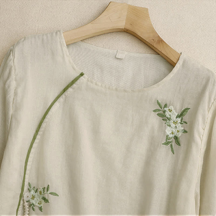 Camicia da donna a maniche a tre quarti con scollo rotondo e ricamo floreale a foglie verdi, colore beige Buddha Stones. - image 2