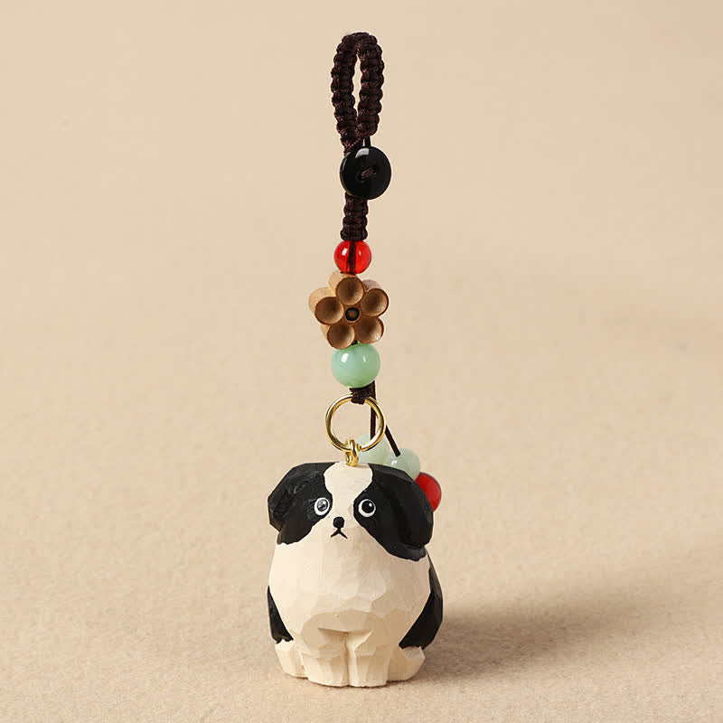 Buddha Stones Portachiavi in ​​legno intagliato con cane, Om Mani, Padme, Hum e la saggezza. - Cane bianco e nero - image 0